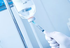 hand reaching for iv therapy